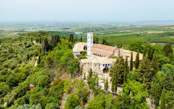 Aerial view of Monastery of Ardenica surrounded by lush greenery in Albania.