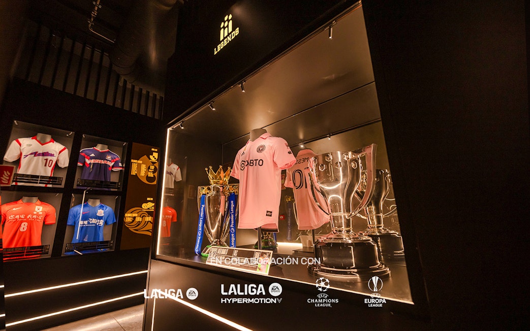 Football jerseys and trophies displayed at Legends of Football Museum.