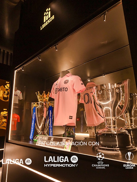 Football jerseys and trophies displayed at Legends of Football Museum.