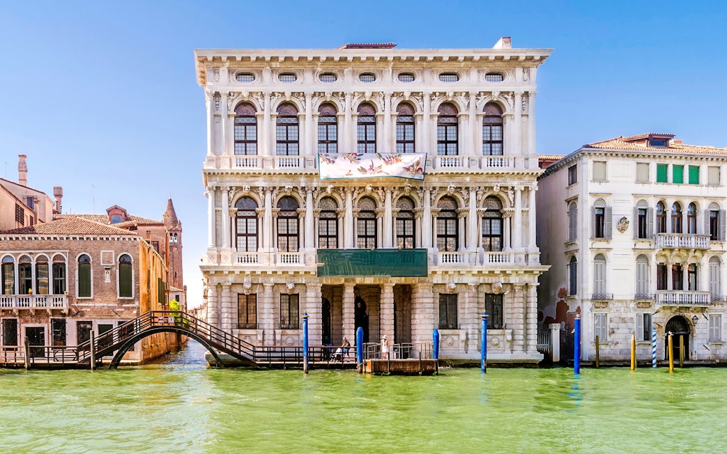 Ca Rezzonico facade along the Grand Canal in Venice, Italy.