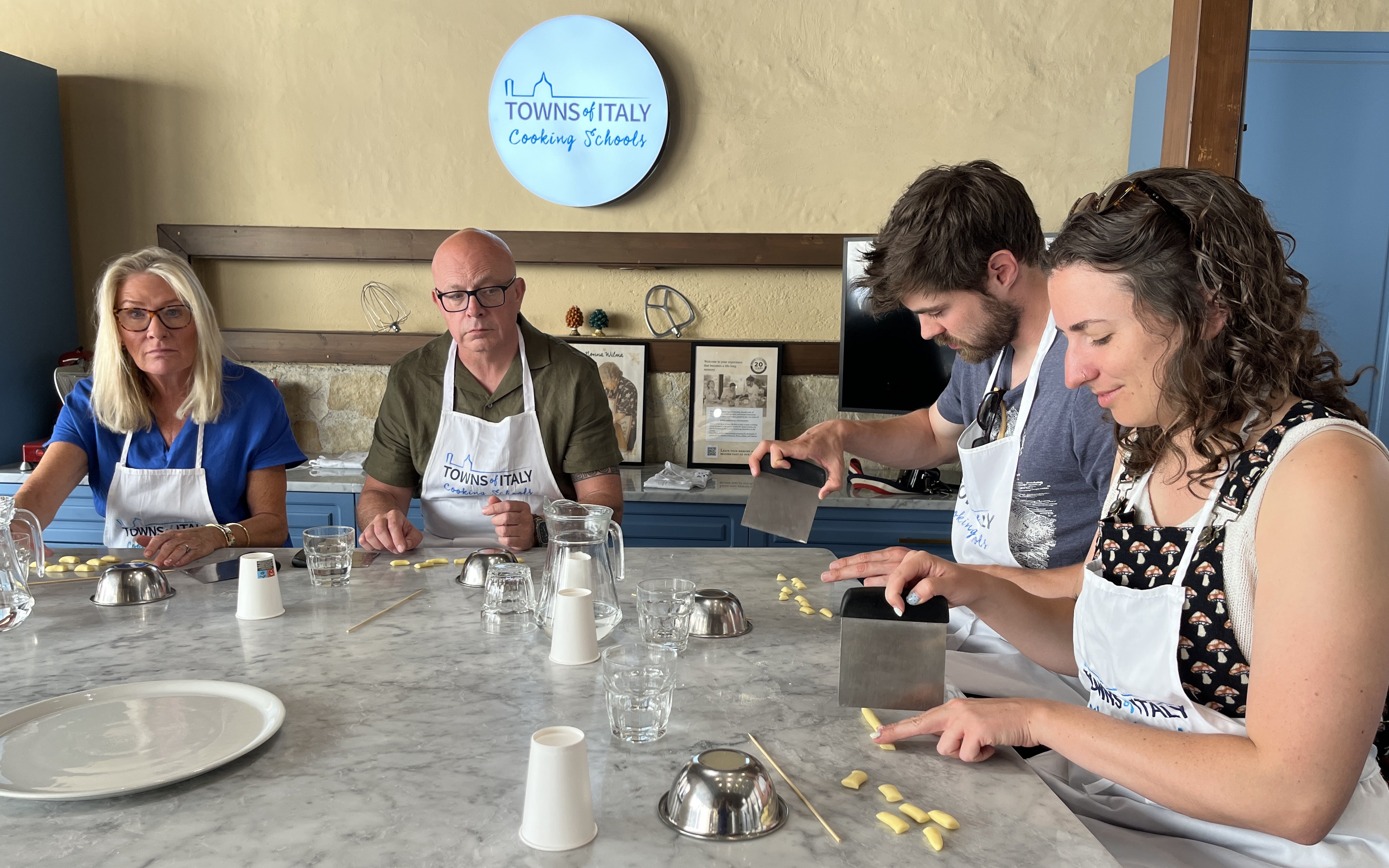 Participants making pasta during Palermo Market Tour and Cooking Class.
