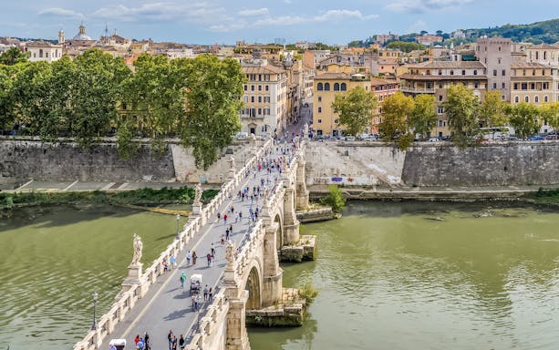 View of Ponte Sant'Angelo and Tiber River from Castel Sant'Angelo terrace in Rome.