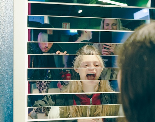 Guests interacting with mirror exhibit at World of Illusion, Dublin.