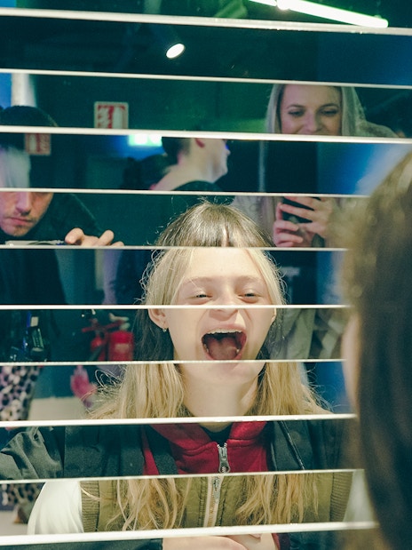 Guests interacting with mirror exhibit at World of Illusion, Dublin.