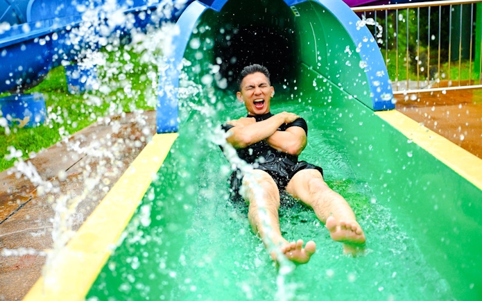 Tourist on a water slide at Legoland Malaysia.