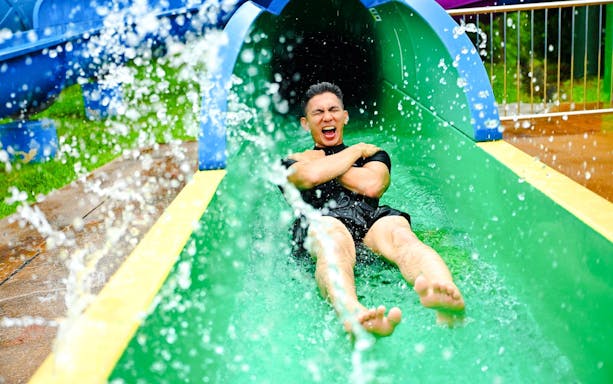 Tourist on a water slide at Legoland Malaysia.