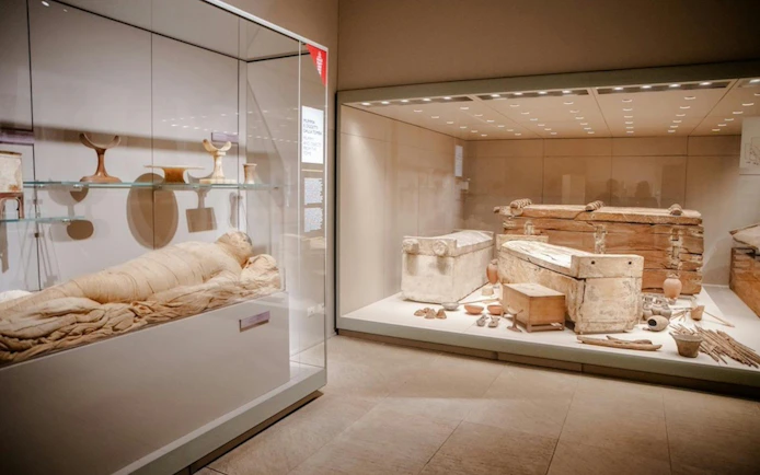 Mummies and sarcophagi display at the Egyptian Museum in Turin.