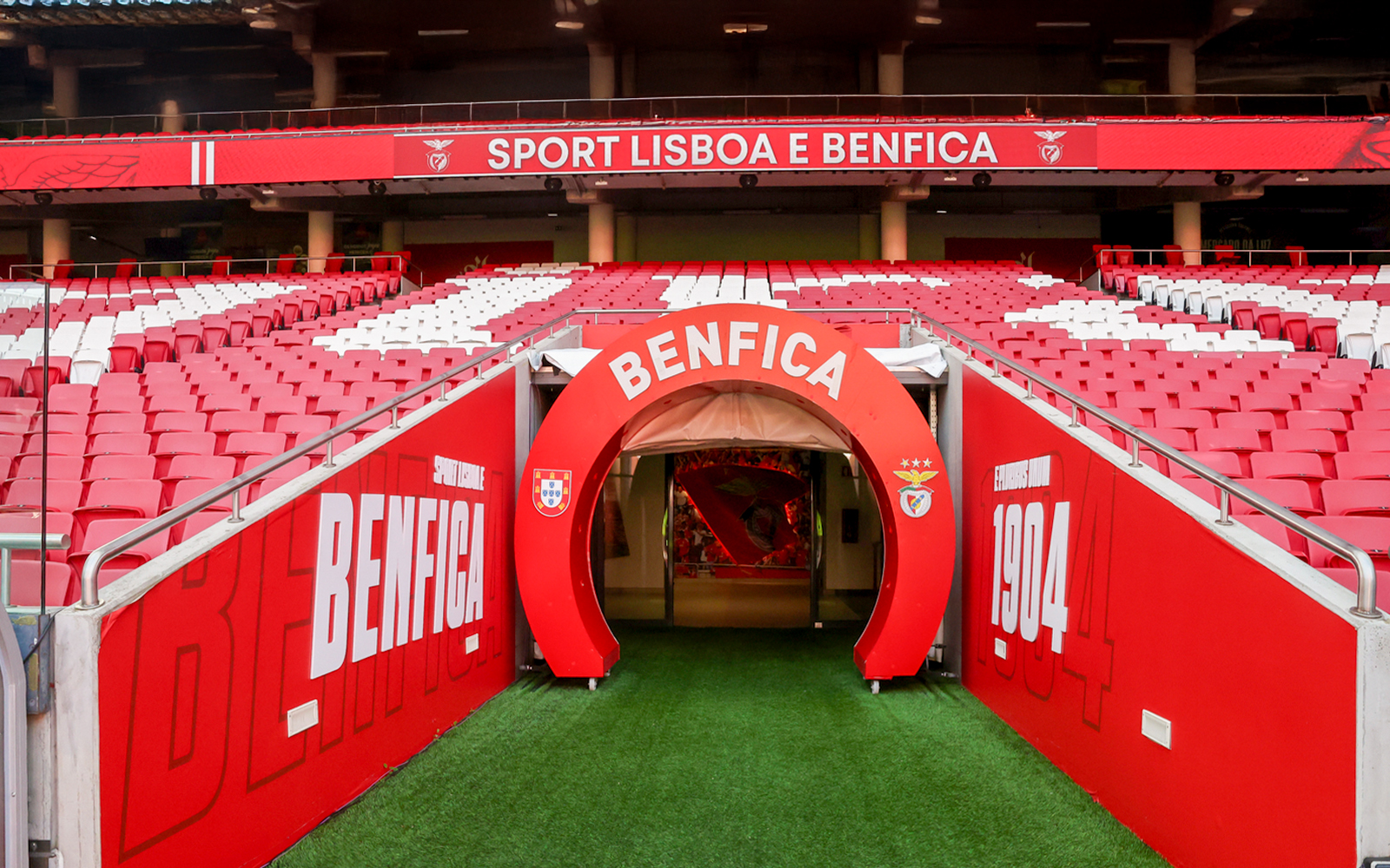 Benfica Stadium player entrance with red and white seating in Lisbon, Portugal.