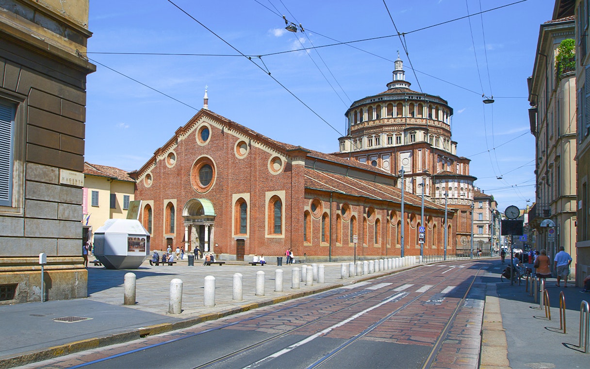 Santa Maria delle Grazie church in Milan, Italy, with tram tracks in foreground.