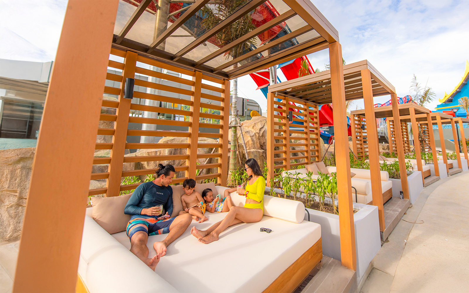 Family relaxing in a cabana at Emerald Cabana, Andamanda Phuket.