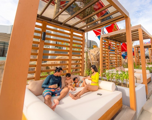 Family relaxing in a cabana at Emerald Cabana, Andamanda Phuket.