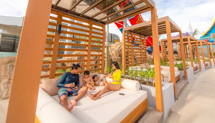 Family relaxing in a cabana at Emerald Cabana, Andamanda Phuket.
