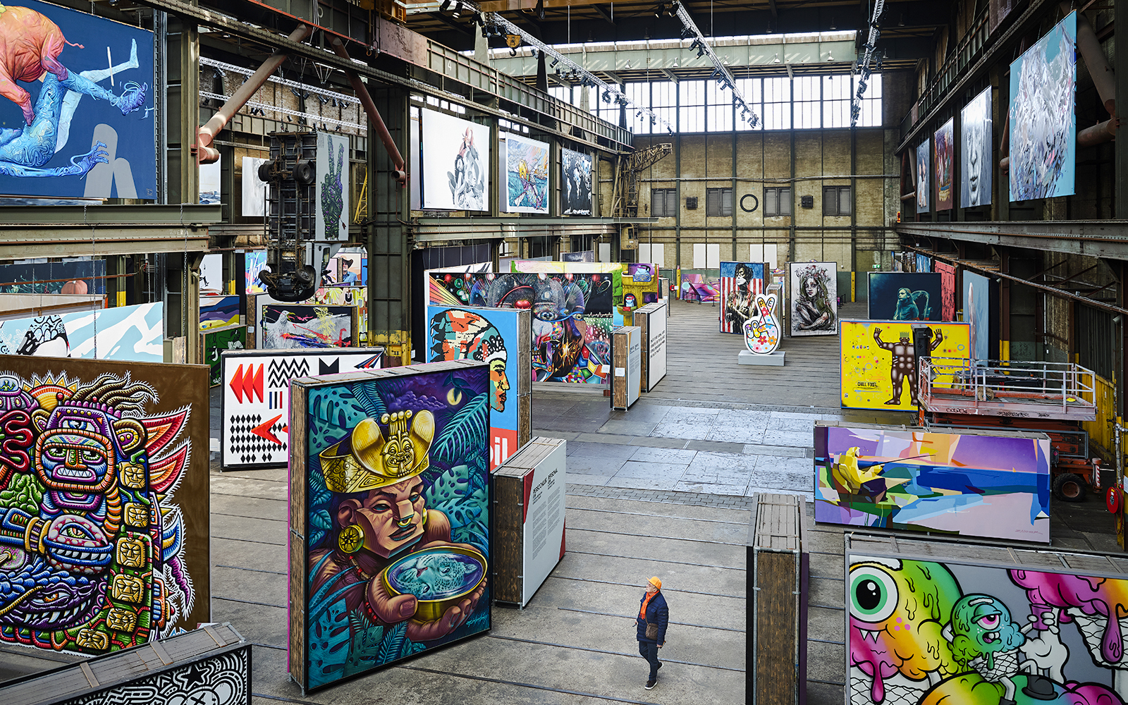 Straat Museum exhibits featuring vibrant street art in an industrial gallery setting.