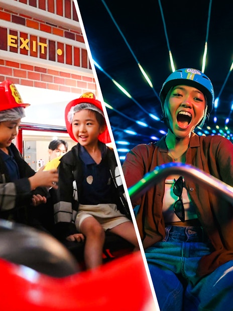 Children in firefighter uniforms role-playing at KidZania fire rescue.