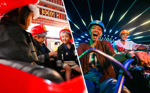 Children in firefighter uniforms role-playing at KidZania fire rescue.