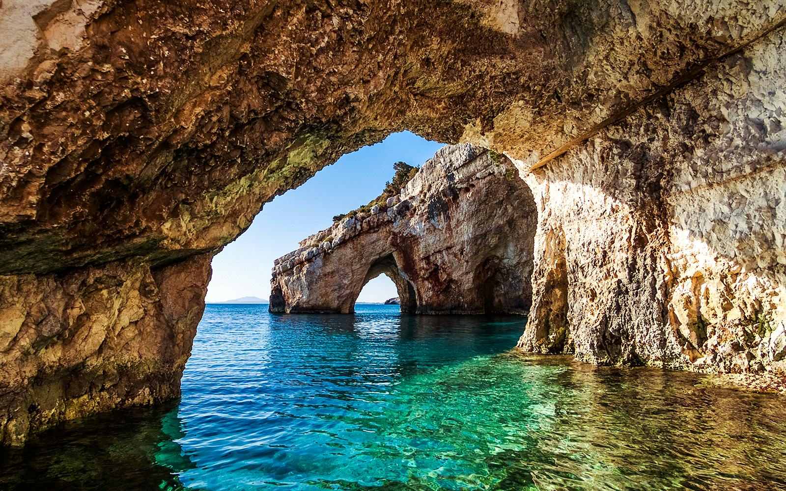 Keri caves with turquoise waters on Marathonisi Island, Greece.