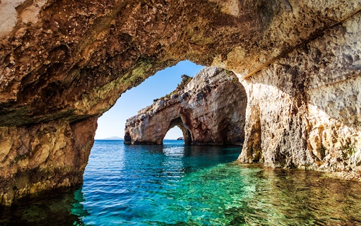 Keri caves with turquoise waters on Marathonisi Island, Greece.