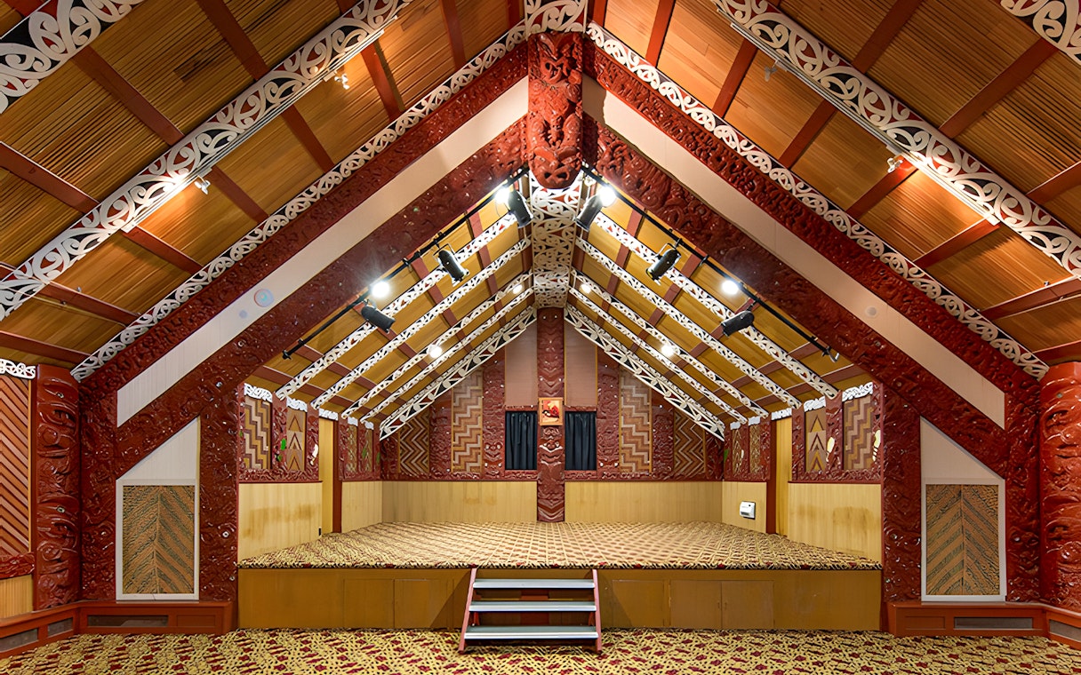 Traditional Māori meeting house interior at Te Puia, Rotorua, New Zealand.