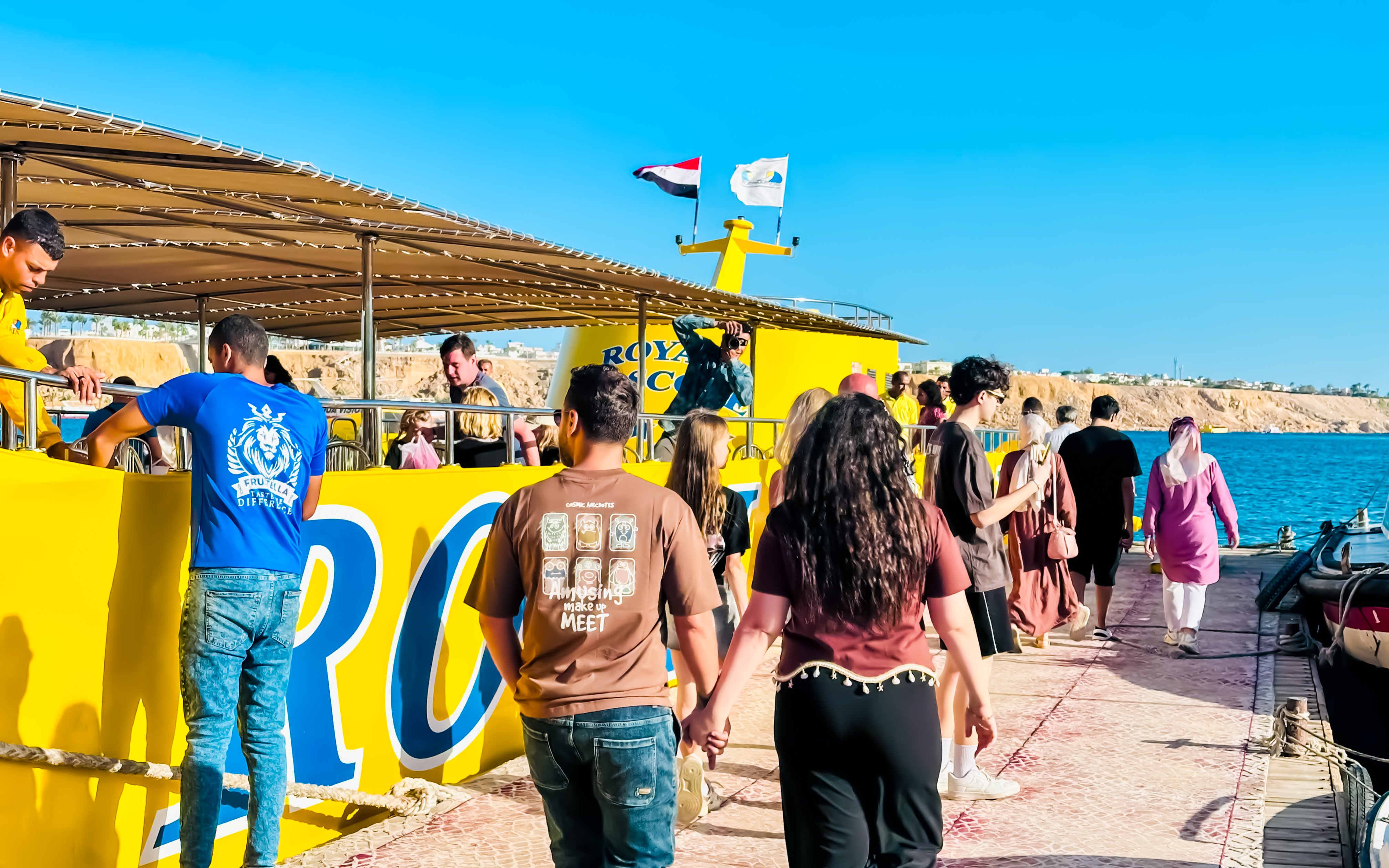 People boarding Royal Seascope Submarine in Hurghada, Egypt.