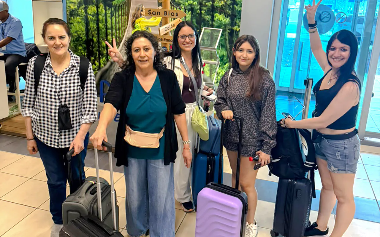 Group of travelers with luggage at Tocumen Airport, Panama City transfer service.