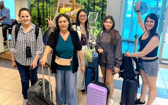 Group of travelers with luggage at Tocumen Airport, Panama City transfer service.
