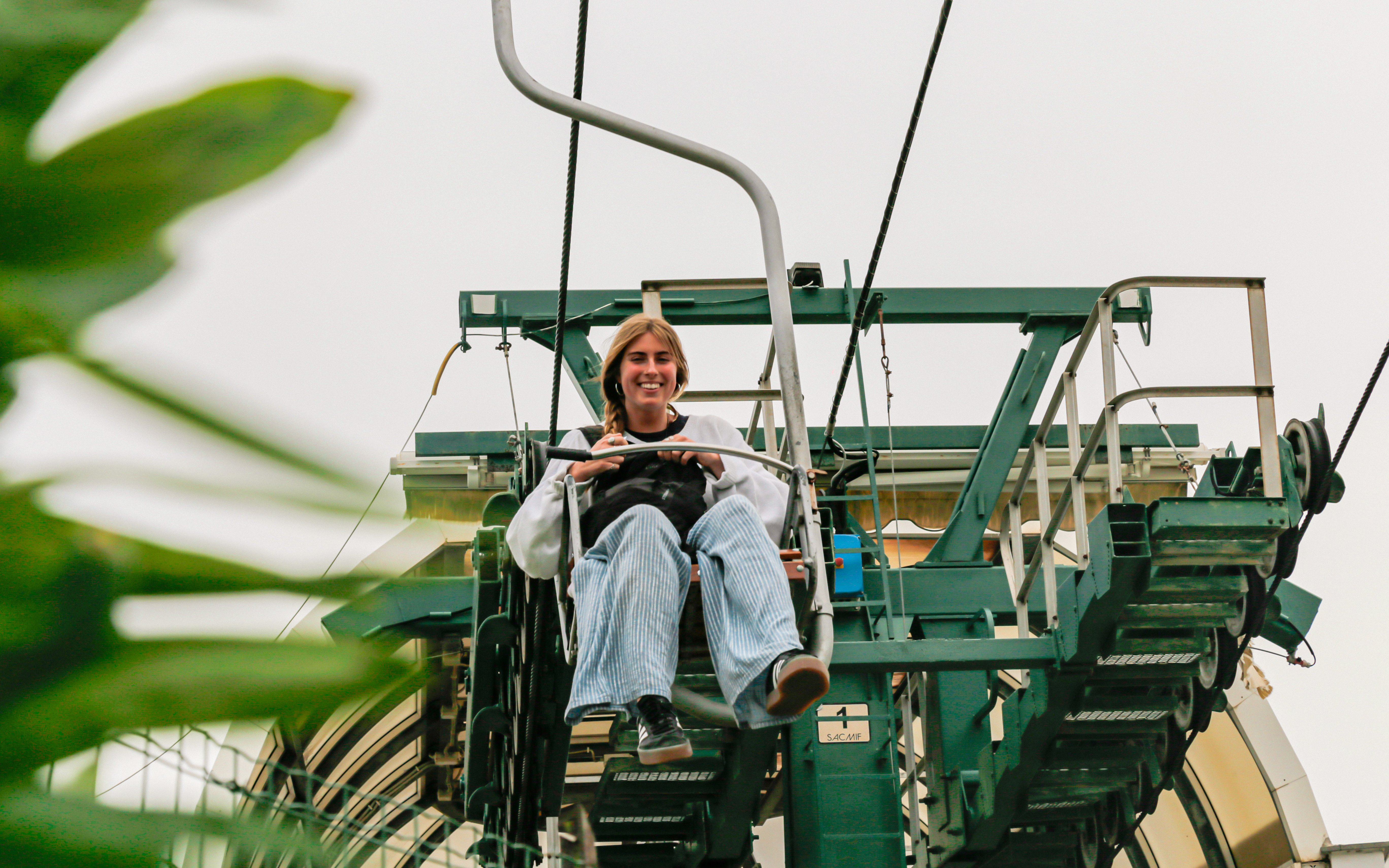 Tourist riding Monte Solaro Chair Lift in Anacapri, Italy.