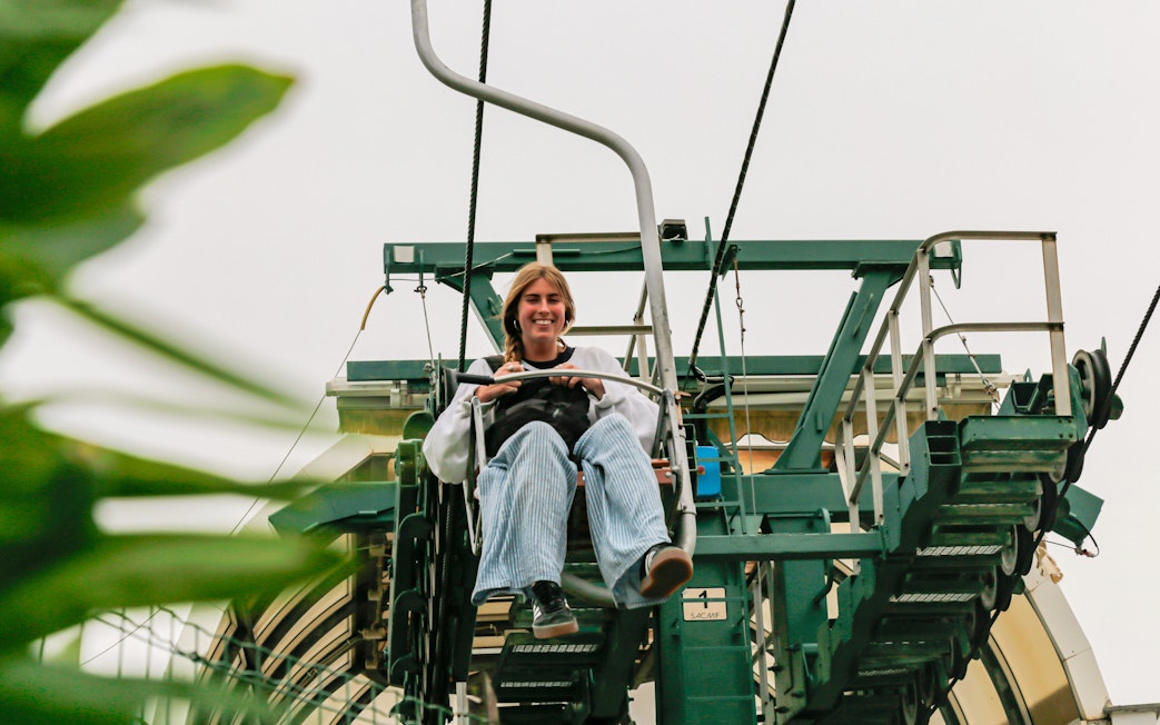Tourist riding Monte Solaro Chair Lift in Anacapri, Italy.
