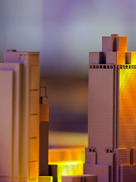 Model buildings illuminated at the Amsterdam in Motion exhibit.