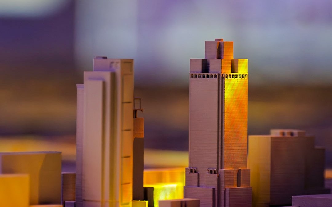 Model buildings illuminated at the Amsterdam in Motion exhibit.