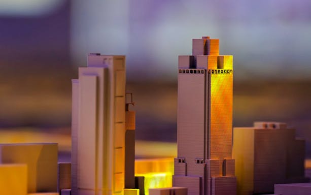 Model buildings illuminated at the Amsterdam in Motion exhibit.