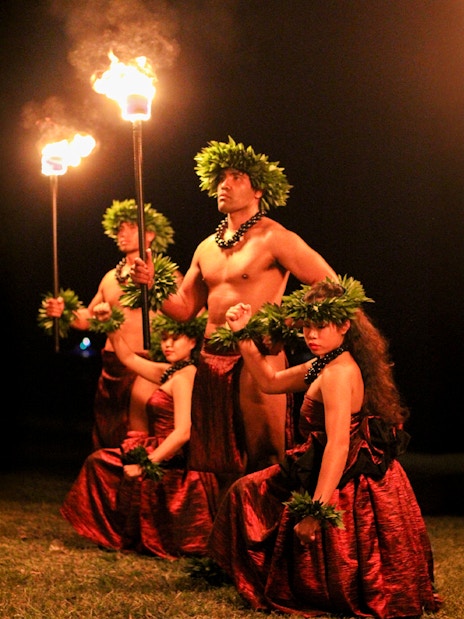 Traditional Hawaiian dancers with torches at Moana Luau, Hawaii.