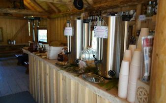 Hot beverage station in a rustic wooden cabin, part of the Zakopane tour experience.