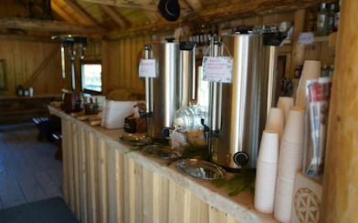 Hot beverage station in a rustic wooden cabin, part of the Zakopane tour experience.