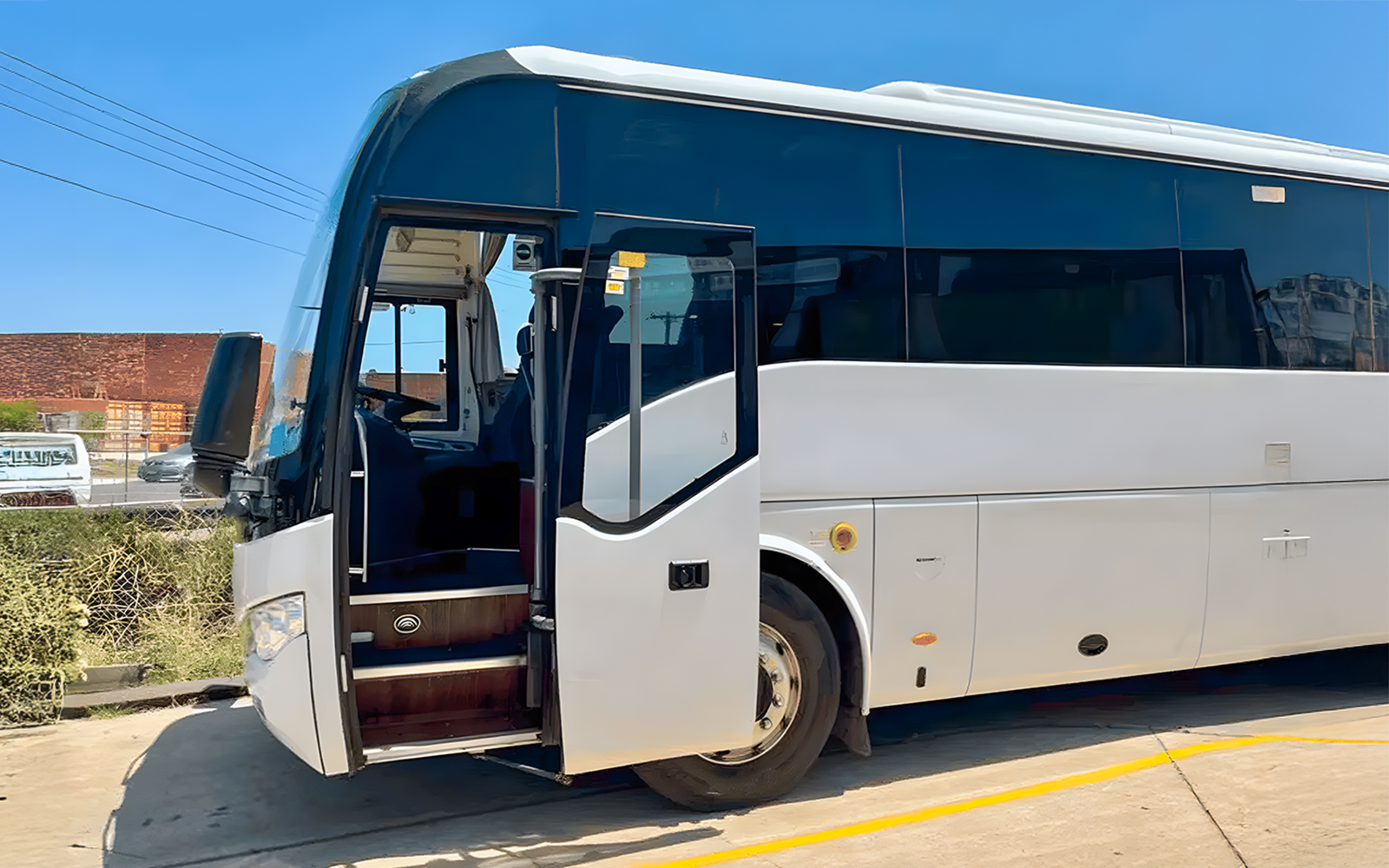 Great Ocean Road Reverse Tour bus on scenic coastal route, Melbourne, Australia.
