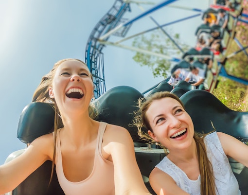 Riders enjoying a roller coaster at Port Aventura Park.