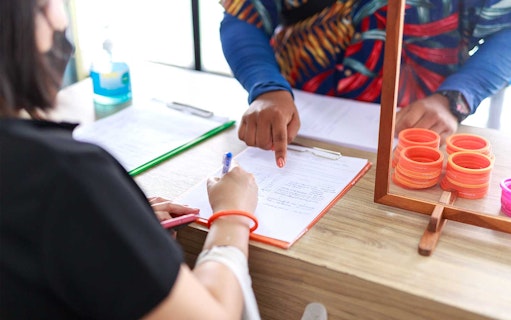 Tourist signing in for Similan Islands day tour from Phuket/Khaolak.