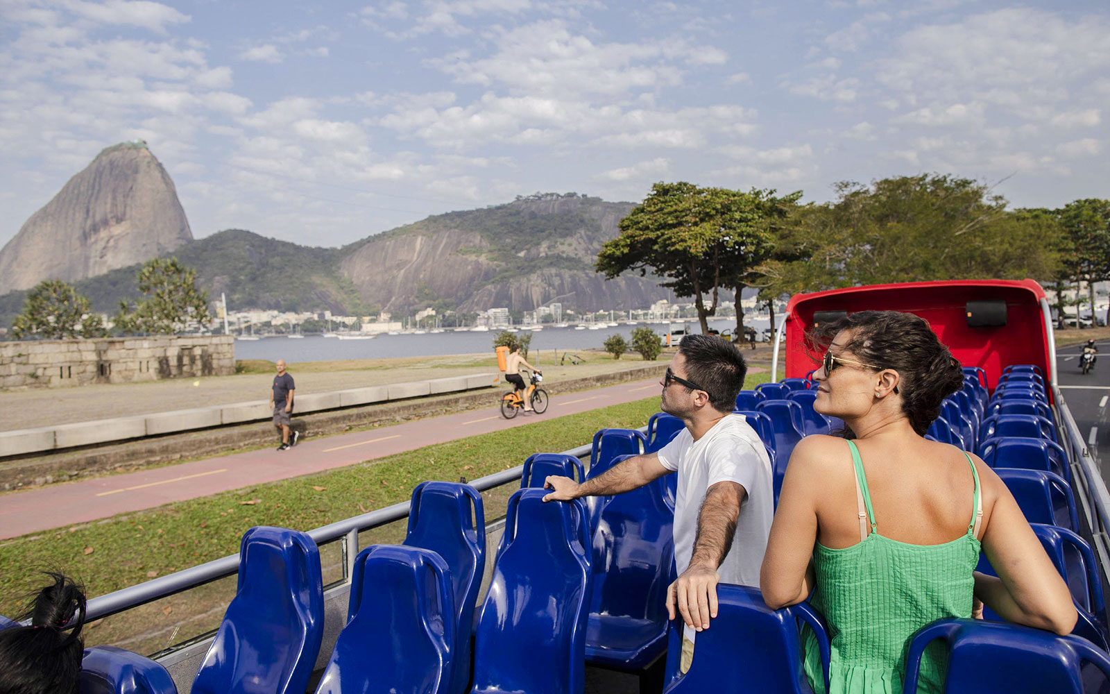 Open-top bus tour in Rio de Janeiro with view of Sugarloaf Mountain.