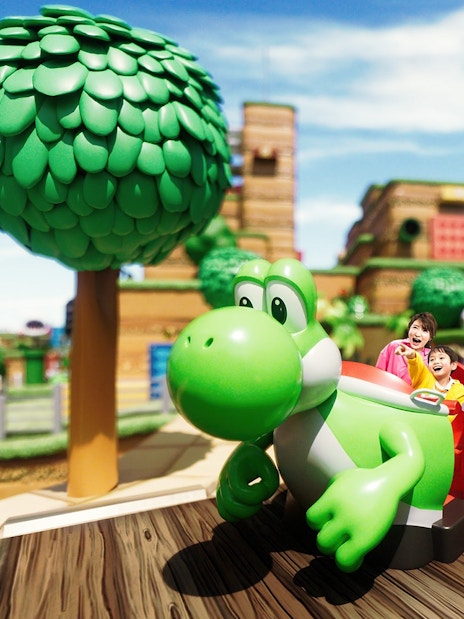 Visitors enjoying Yoshi's Adventure ride at Universal Studios Japan.