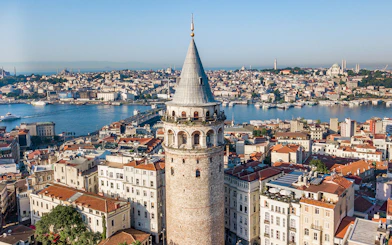 Galata Tower overlooking Istanbul cityscape and Bosphorus.