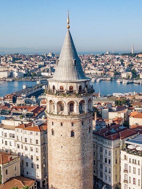 Galata Tower overlooking Istanbul cityscape and Bosphorus.