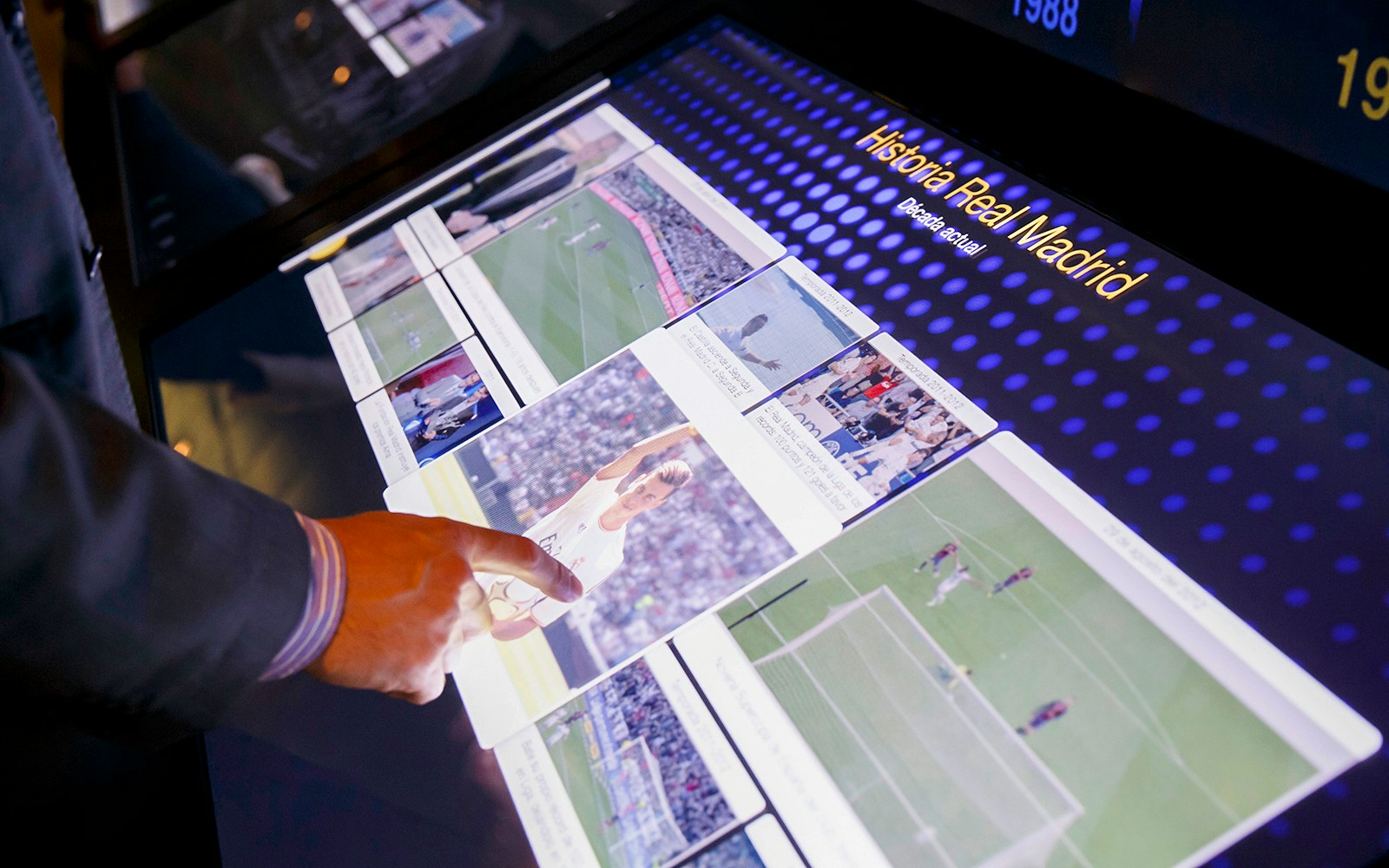 Interactive display showcasing football history at Santiago Bernabeu Stadium, Madrid.