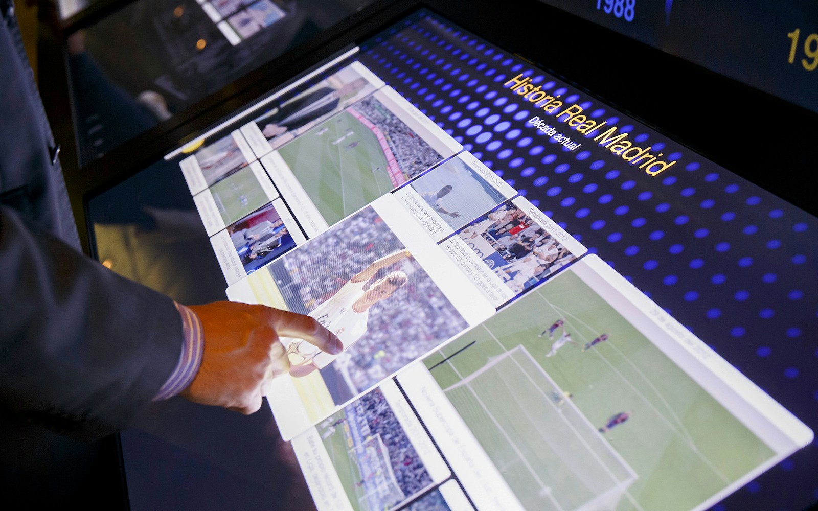 Interactive display showcasing football history at Santiago Bernabeu Stadium, Madrid.