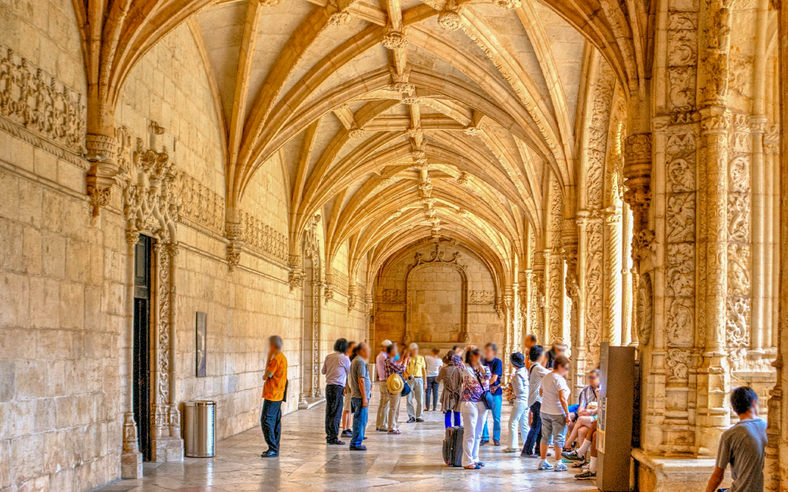 Cloister of the Jeronimos Monastery in Lisbon, Portugal, showcasing intricate Gothic architecture.