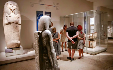 Visitors exploring ancient artifacts at the Egyptian Museum in Turin.