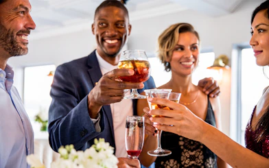 Guests toasting drinks on Marina del Rey Premier Dinner Cruise.