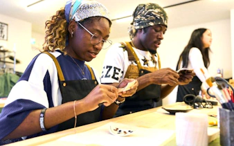 Participants practicing kintsugi at a workshop in Shinjuku, Tokyo.