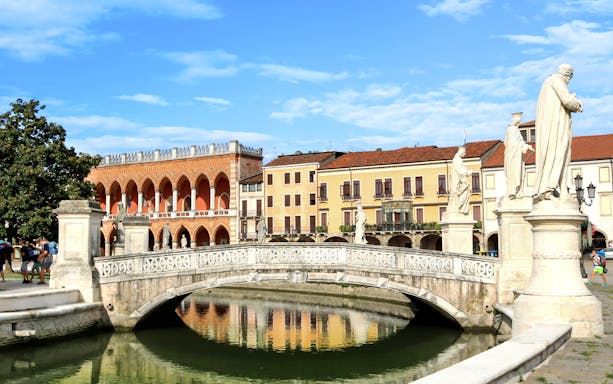 Bridge and statues at Prato della Valle, Padua, during a guided walking tour.