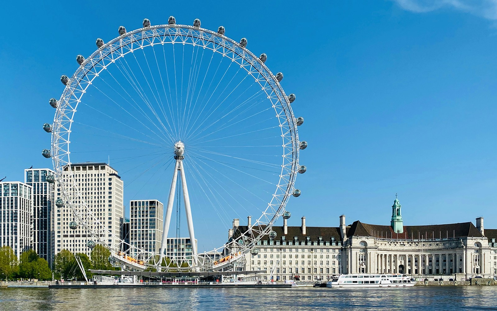 London Eye view from a sightseeing cruise on the River Thames.