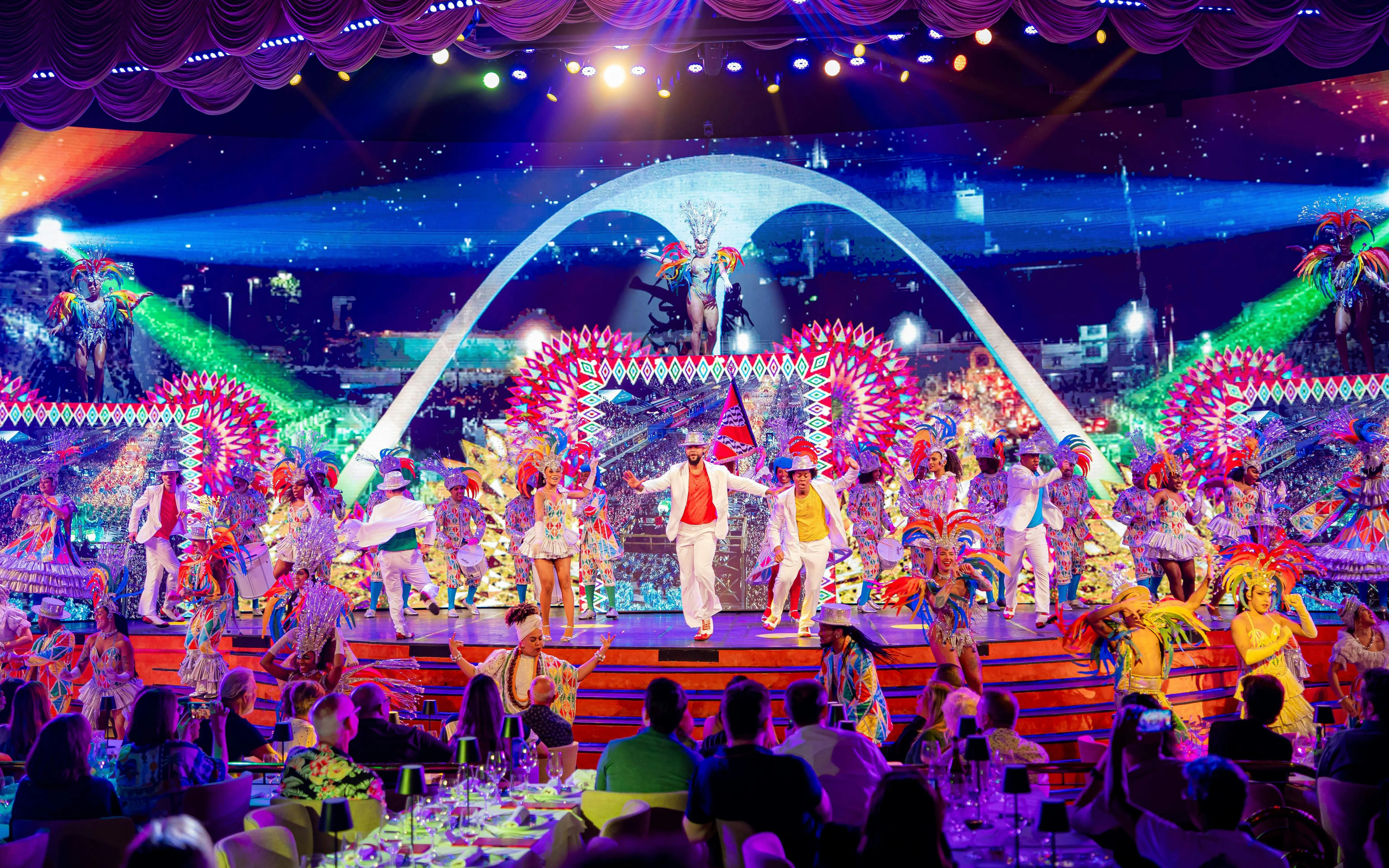 Performers in vibrant costumes on stage at Roxy Dinner Show, Rio de Janeiro.