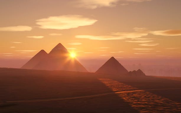Sunrise over the Pyramids of Giza, Egypt, highlighting the Horizon of Khufu experience.